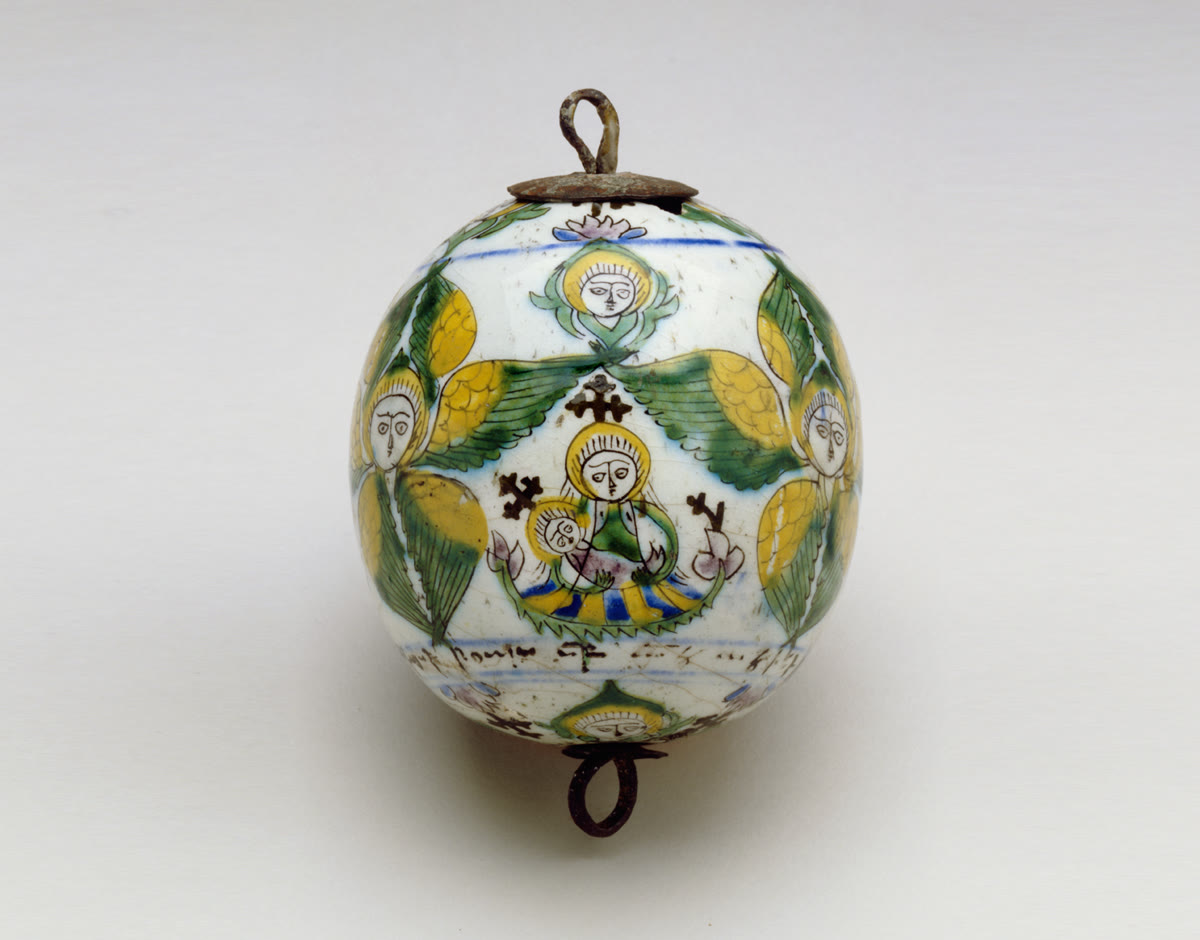 Egg-shaped ceramic ornament painted with seraphim and the Virgin and Child