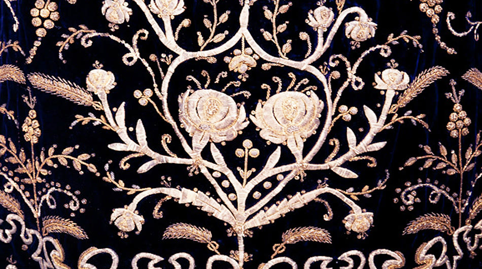 Gold and silver flowers embroidered on dark velvet